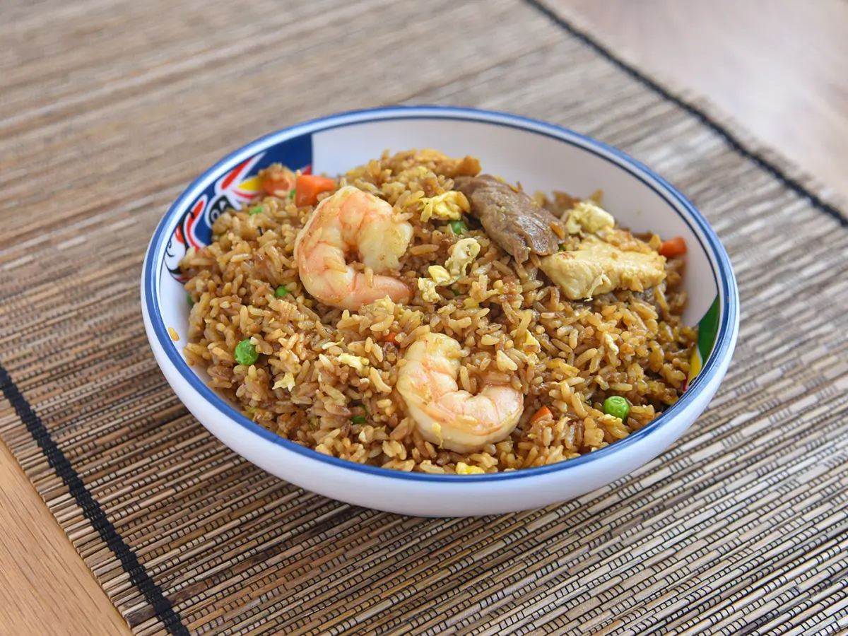 Seafood and Mixed Meat Fried Rice combined with succulent shrimp, pieces of meat, scrambled eggs, peas, and carrots at Dragon City, a Chinese restaurant in Albany
