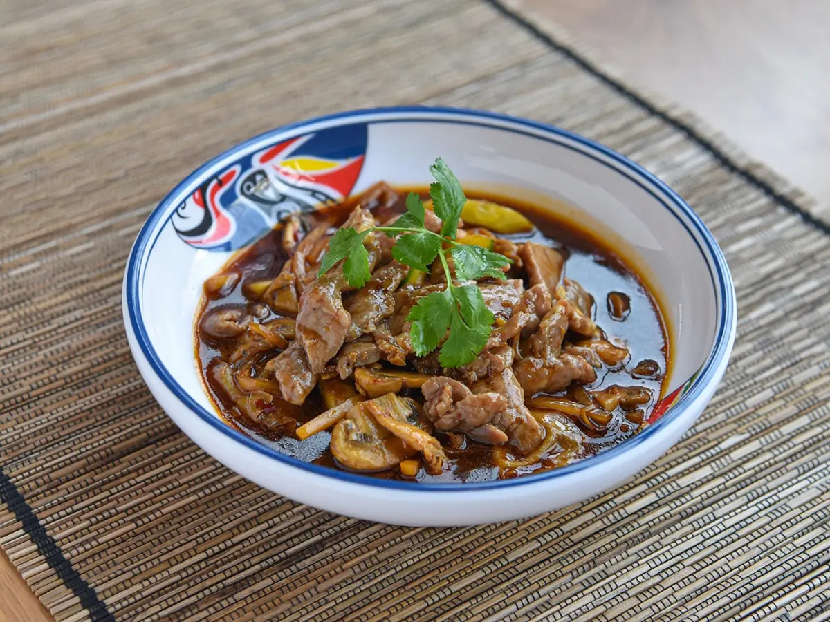 Stir - Fried Beef with Sauce has tender slices of beef stir - fried with sauce and vegetables at Dragon City, a Chinese restaurant in Albany